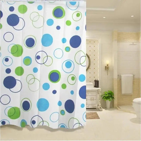 White shower curtain featuring a pattern of blue and green circles.