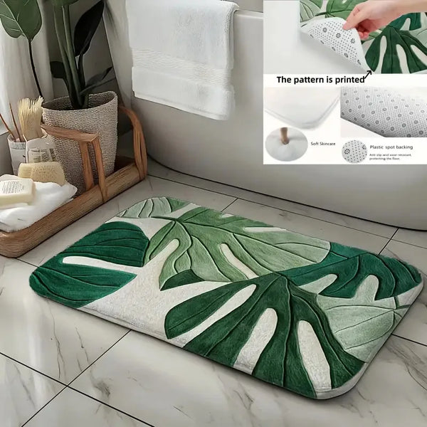 A green and white botanical leaf carpet mat placed on a tiled floor next to a bathroom sink.
