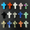 A collection of natural agate and jasper cross pendant charms in various colors including blue, orange, green, and white.
