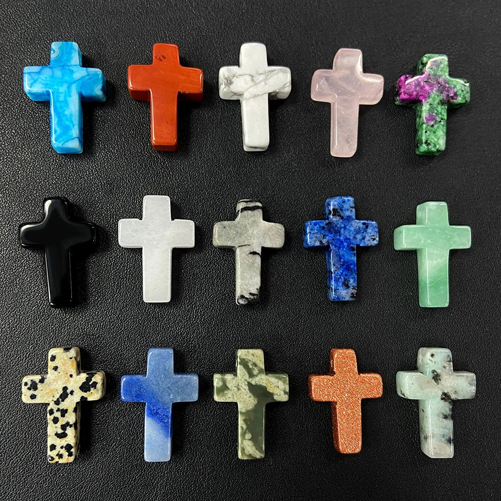 A collection of natural agate and jasper cross pendant charms in various colors including blue, orange, green, and white.