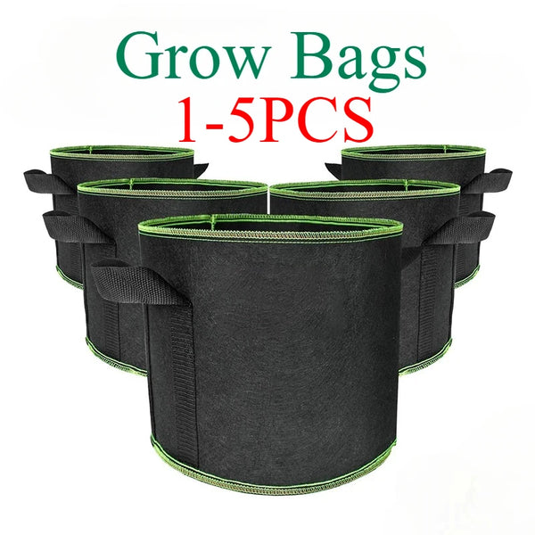 A stack of five black non-woven plant grow bags with green trim and handles.