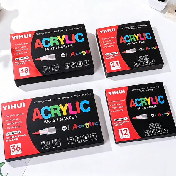 A set of Yihui Acrylic Brush Markers in various colors and tips displayed on a white surface.