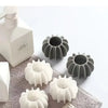 A set of reusable laundry balls in white and gray for pet hair and lint removal