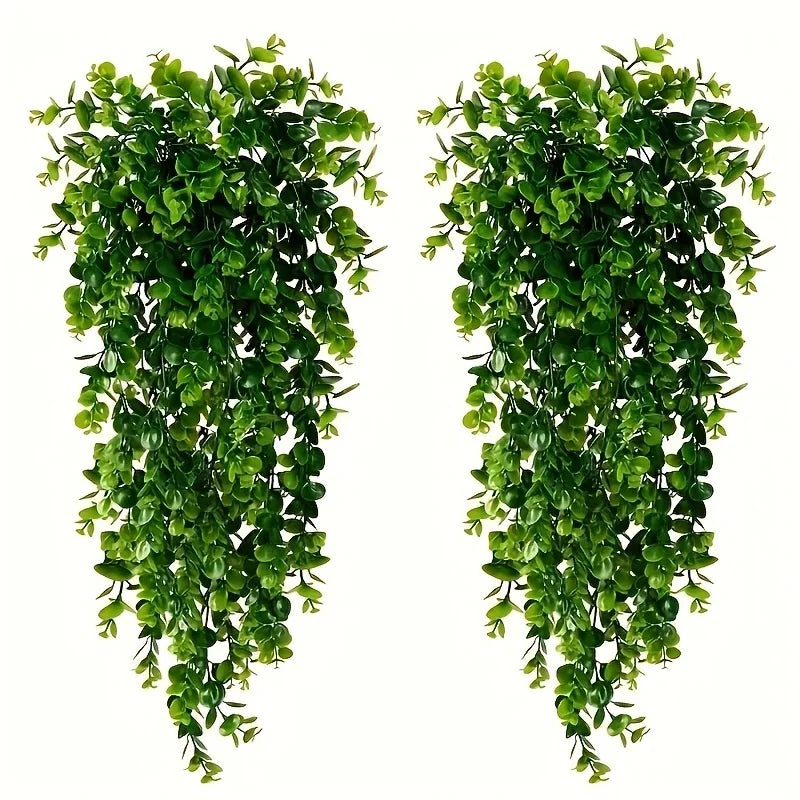 Two vertical garlands of artificial green leaves used for home decor