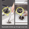 Close-up of squeezable bristles going through a sink drain hole and into the pipe.