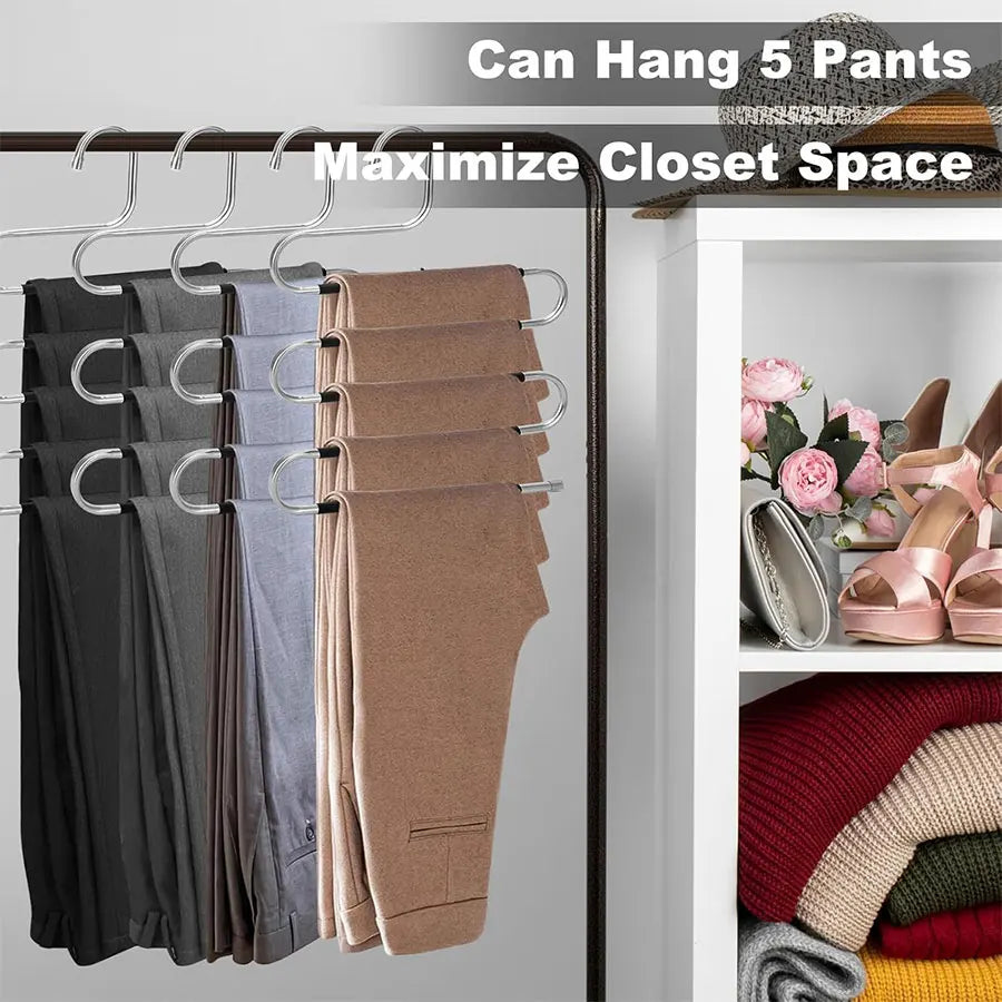A stainless steel hanger rack displaying five pairs of pants hanging to maximize closet space.