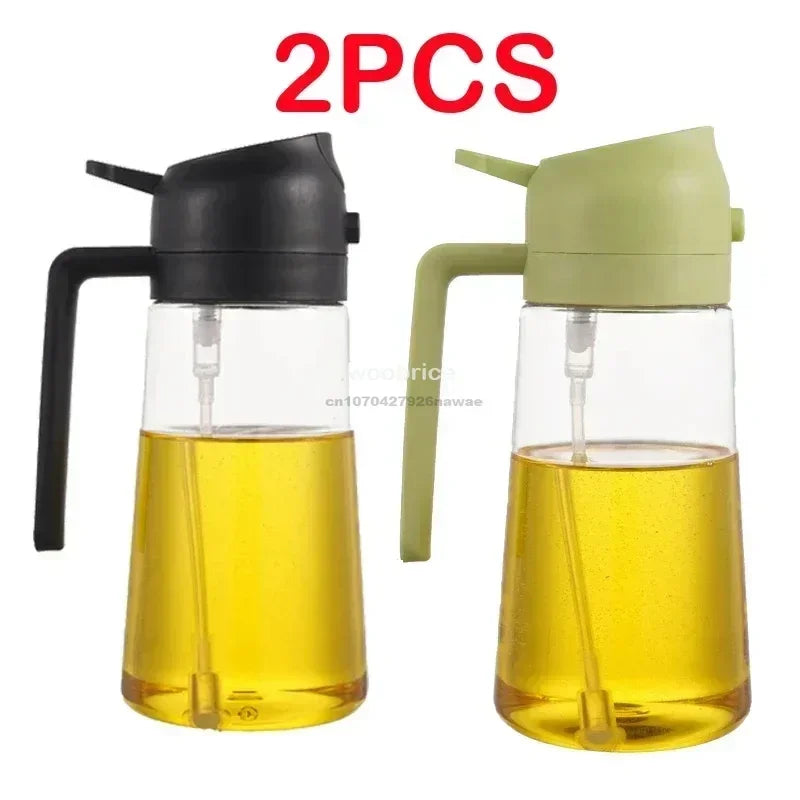 A pair of clear glass oil spray bottles with black and light green caps, used for cooking.