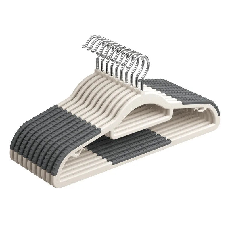 A set of non-slip heavy-duty plastic hangers with 360 degree swivel hooks in a light beige color.