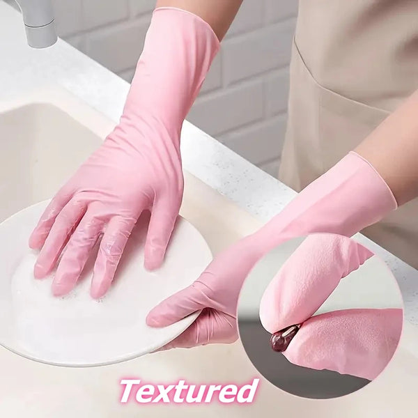 A hand wearing a pink textured disposable cleaning glove is shown on a white plate.