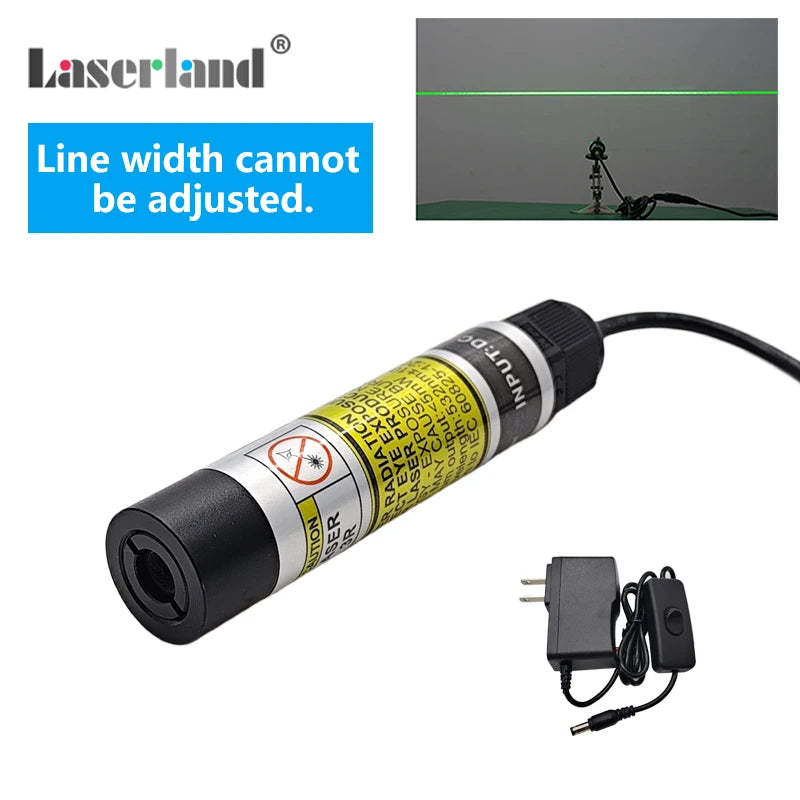 Módulo láser negro con conector y cable junto a una línea láser verde sobre una superficie oscura.