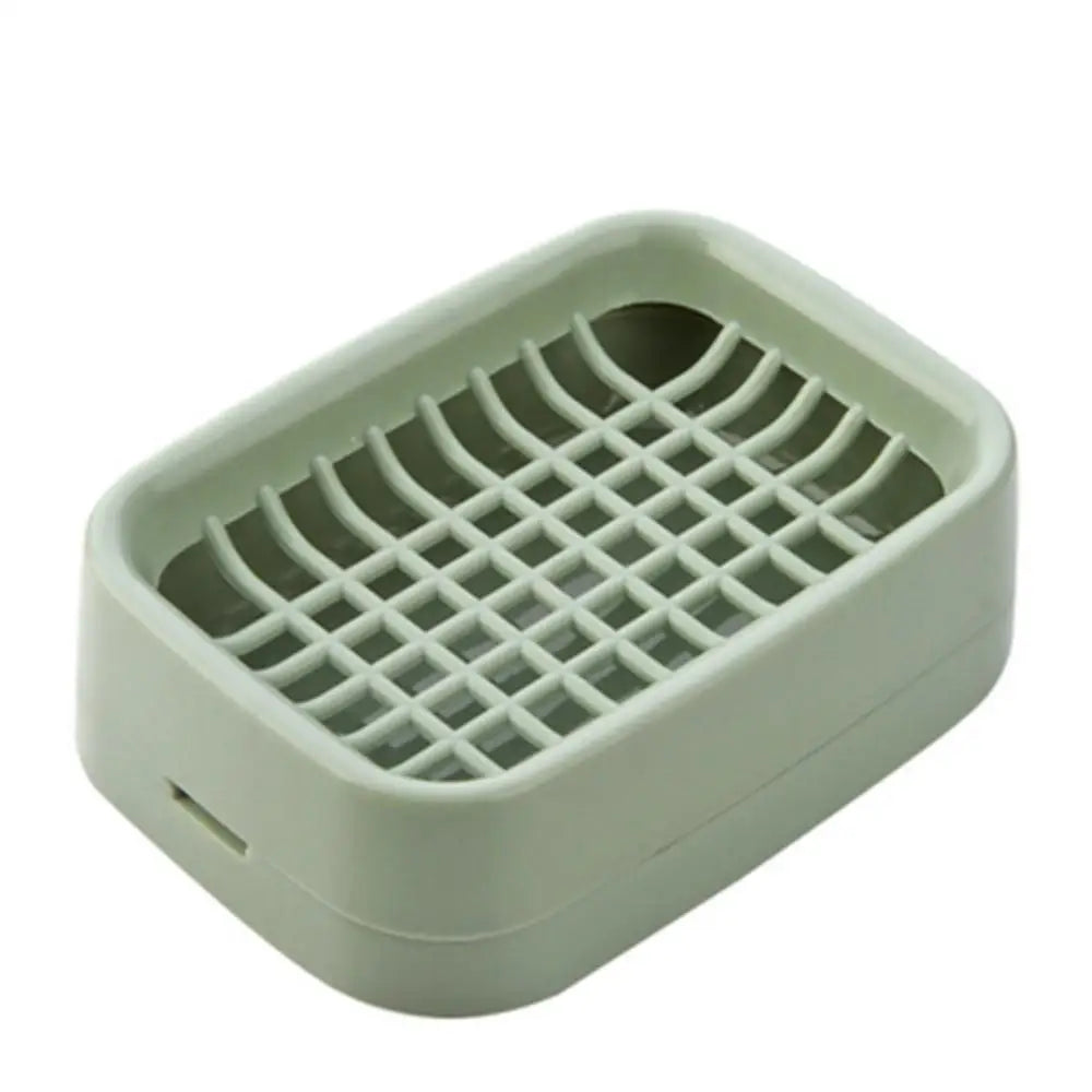 A light green double layer drain soap dish with a grid pattern for draining water.