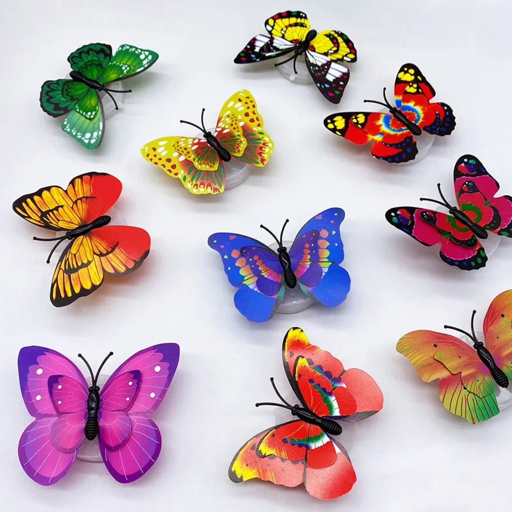 A collection of colorful, luminous 3D butterfly wall lights in various shades of green, yellow, orange, and pink.