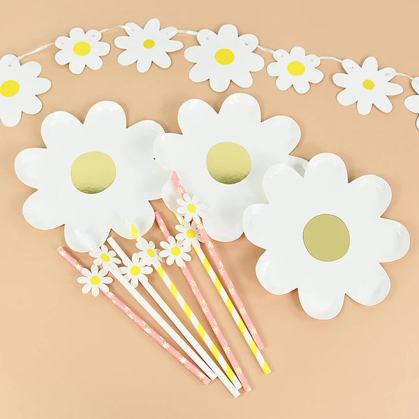 White floral disposable party decor set featuring daisy shapes on a string and individual flower cutouts
