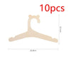 Ten pieces of light wood clothing hangers shaped like a stylized letter C or hook.