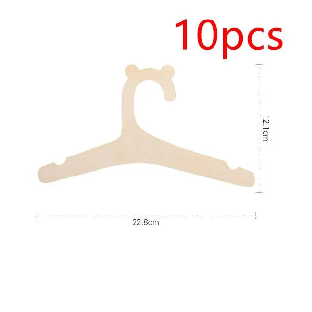 Ten pieces of light wood clothing hangers shaped like a stylized letter C or hook.