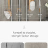 Wall mounted broom holder showing various storage functions like tool storage and strength bearing