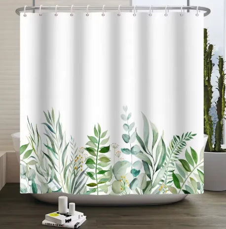 A white shower curtain featuring a tropical garden design of green leaves and small flowers.