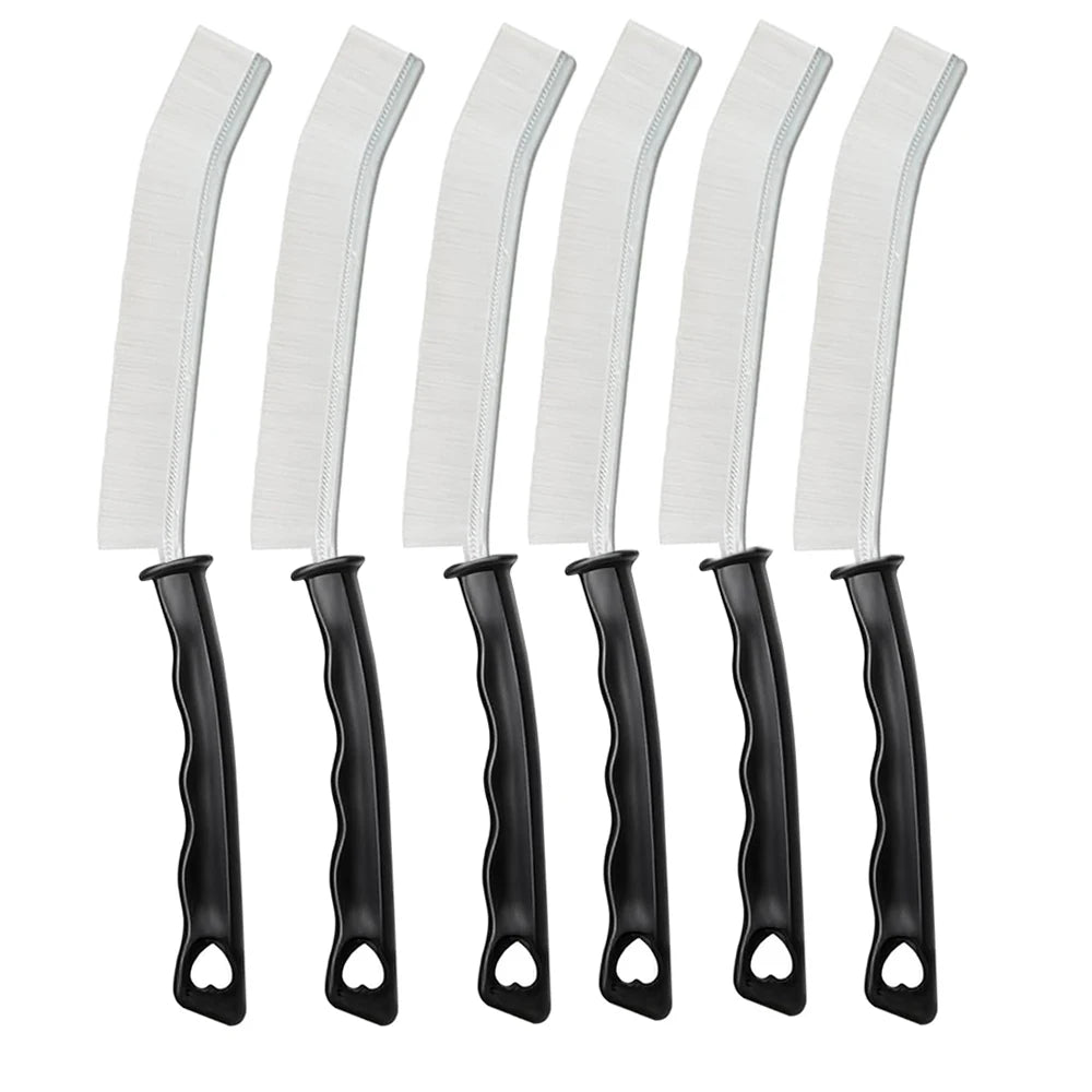 A set of black and white crevice cleaning brushes with hard bristles for tight spaces