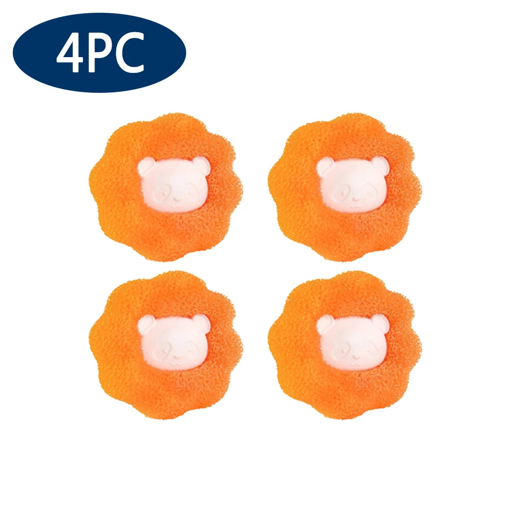 Four reusable orange lint and hair remover balls with white bear-like heads.