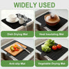A set of black silicone mats used for dish drying, heat insulating, anti-slip, and vegetable drying.