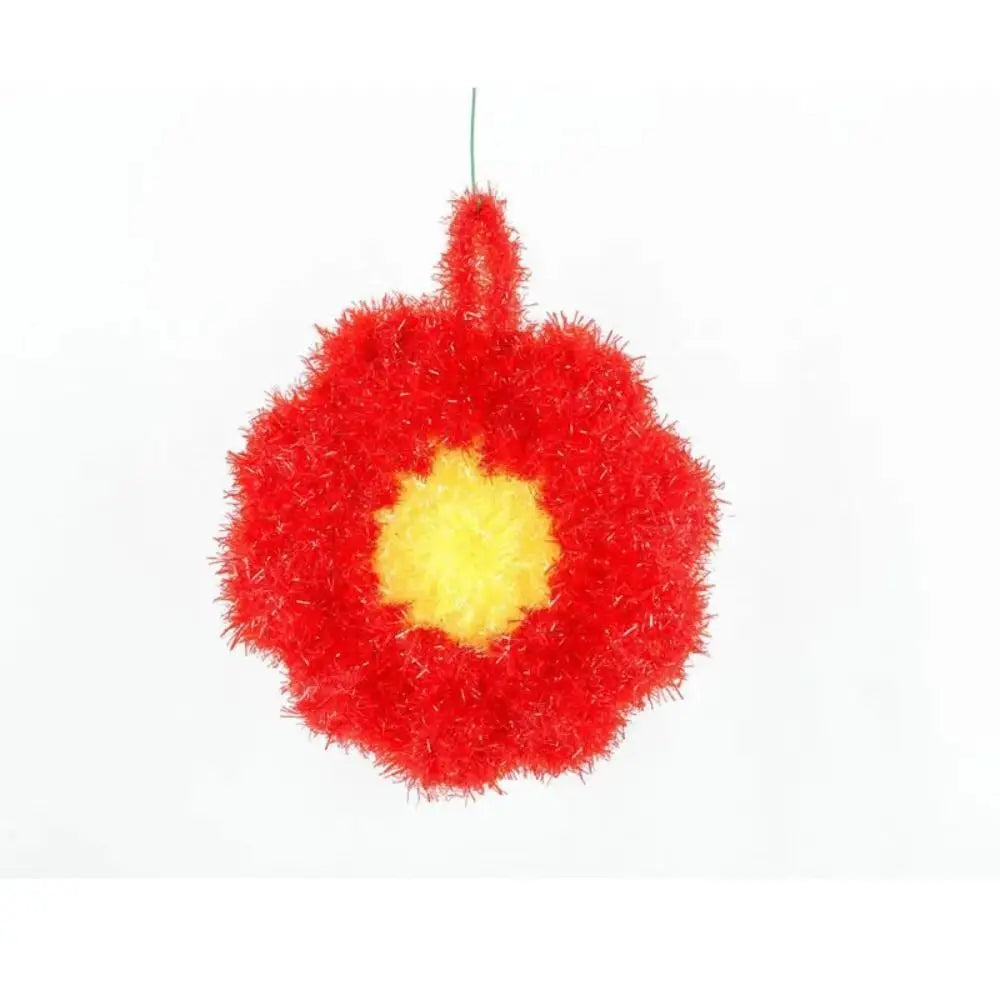 A bright red, fluffy acrylic dish towel with a yellow center.