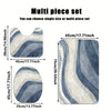 Multi piece set of soft non-slip bathroom rugs in blue and gray tones