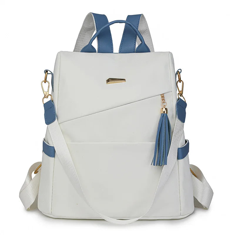 A white and blue PU leather travel backpack with gray straps and gold hardware.