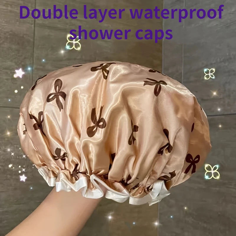 A close-up of a beige satin double layer waterproof shower cap with brown floral accents.