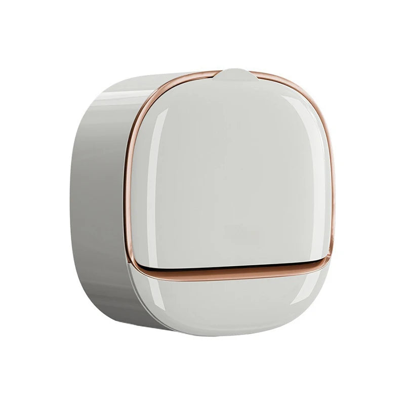 A round, white wall-mounted soap dish with a lid and drainage feature.