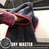 A dark gray microfiber towel is draped over a car, showing its texture and red trim.