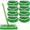 A set of green reusable microfiber mop pads with white trim and a long green handle.