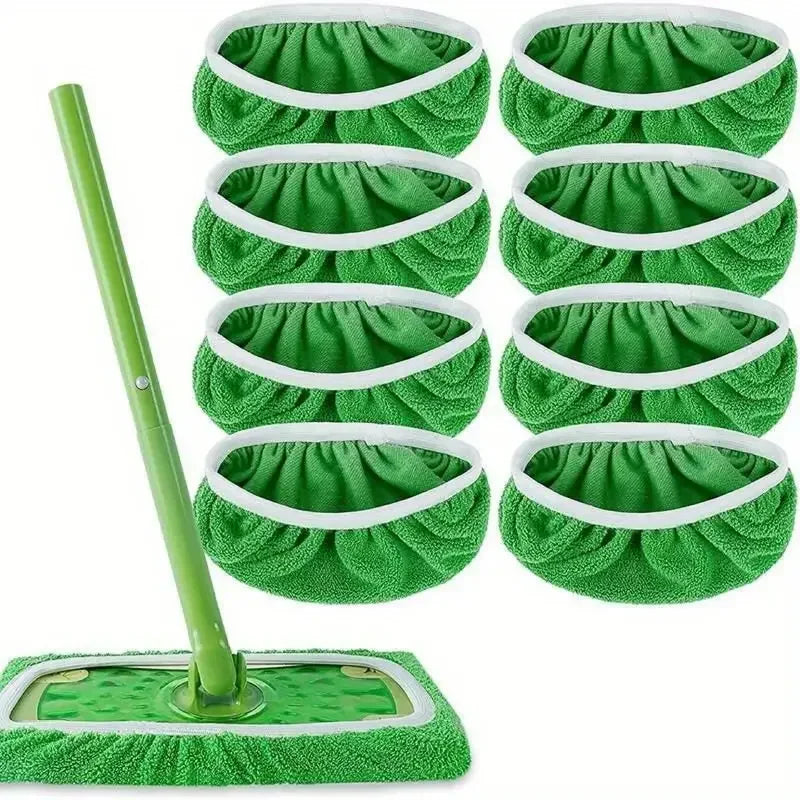 A set of green reusable microfiber mop pads with white trim and a long green handle.