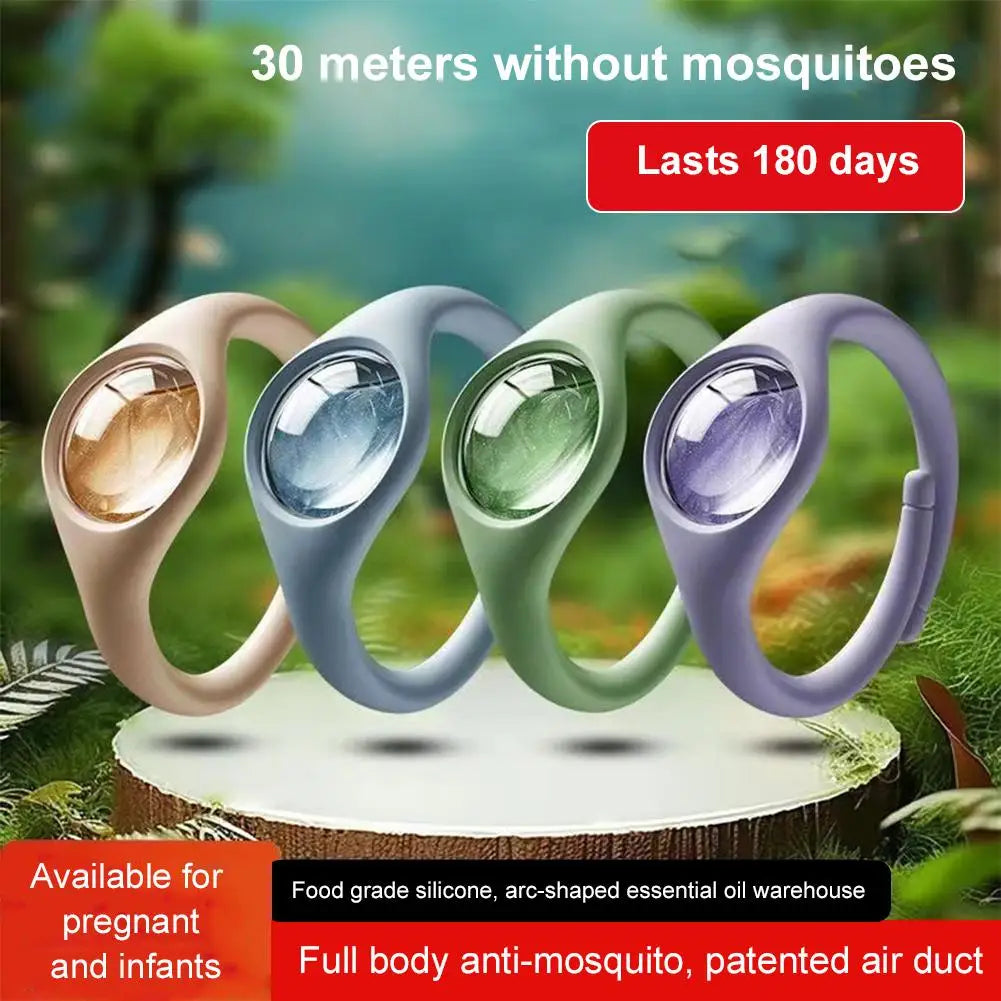 Cuatro pulseras de colores de un repelente natural de mosquitos mostradas sobre una superficie de madera.