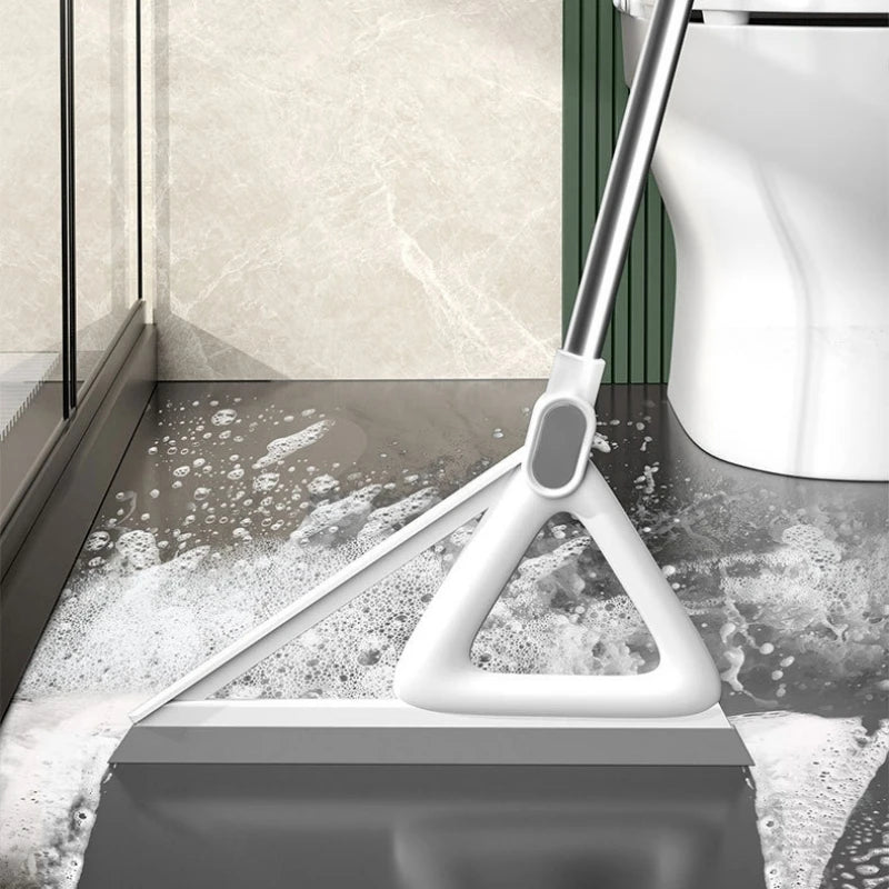 A white silicone window and surface cleaner is shown cleaning a glass surface on a countertop.