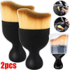 A set of two black and yellow multi-surface cleaning brushes shown with a handheld brush.