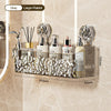 Stainless steel suction cup storage rack holding various bottles and grooming tools in a bathroom setting