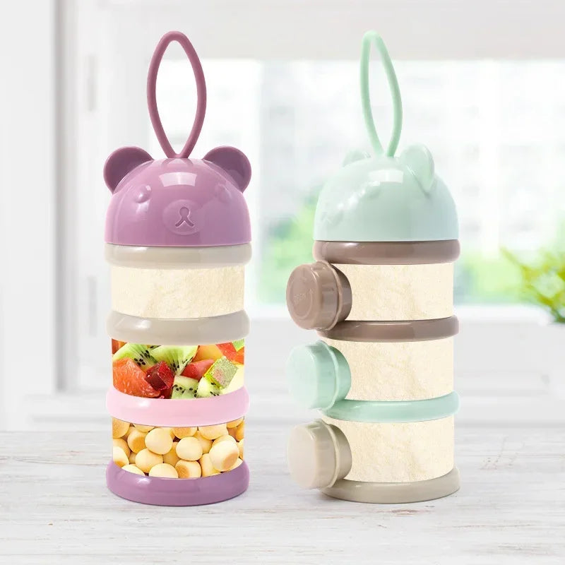 A layered silicone food storage box with purple and mint green components for baby snacks.