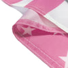 Pink and white flag tapestry fabric folded to show a star design.