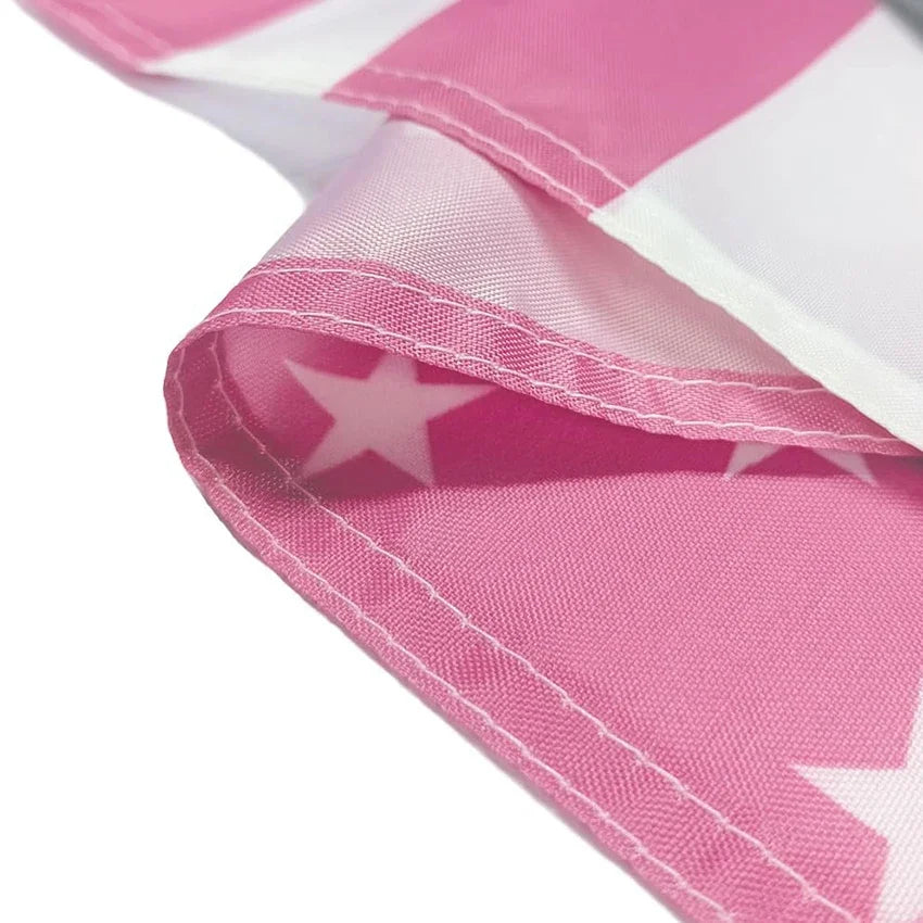 Pink and white flag tapestry fabric folded to show a star design.