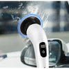 Un limpiador eléctrico blanco con cepillo azul está limpiando una superficie de ventana.