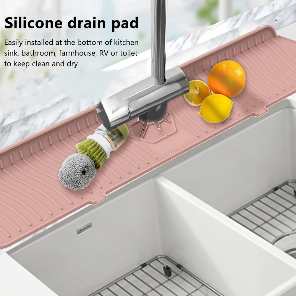 A silicone drain pad is installed at the bottom of a kitchen sink, used to keep it clean and dry.