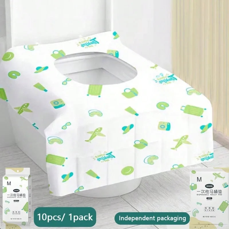 A set of disposable toilet seat covers in light green and white packaged for individual use.