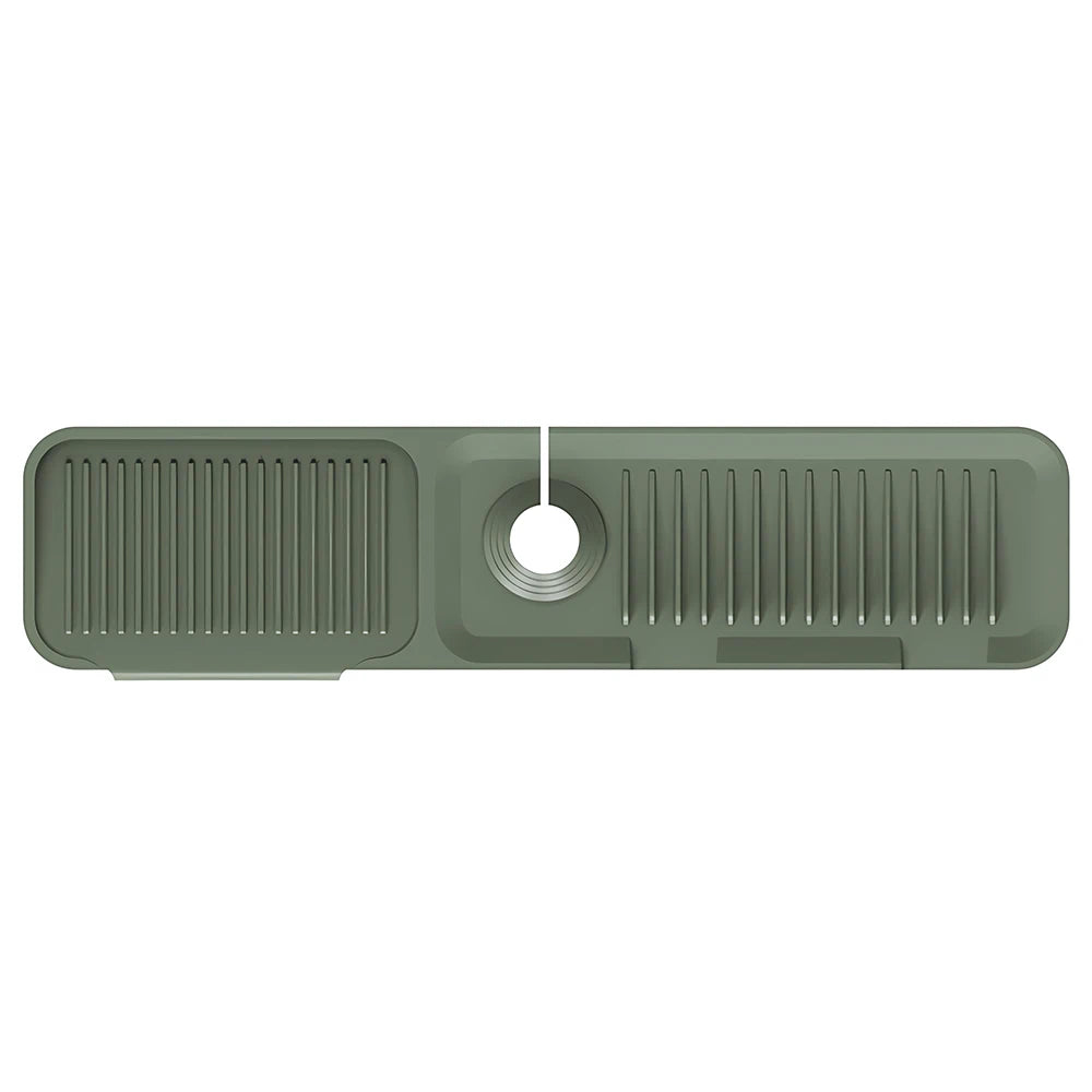 A rectangular silicone sink splash guard mat with vertical ridges and a central drain hole.