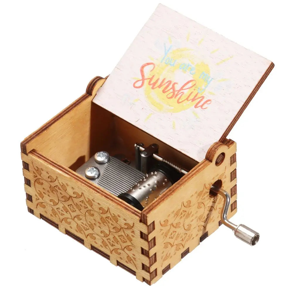 Caja de música de madera manual con tapa rosa claro que dice "Eres sol.
