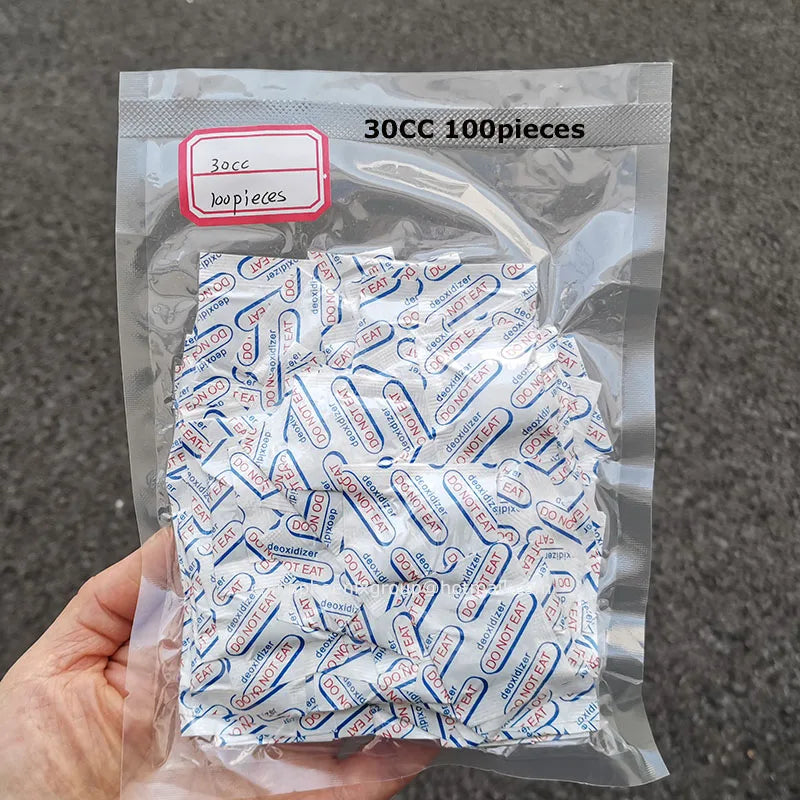 A clear plastic bag containing 300 food-grade oxygen absorbers, labeled for extended dry food storage.