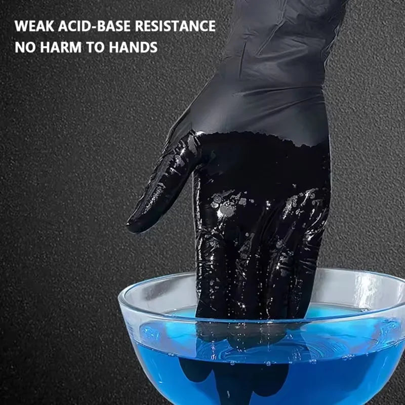 A hand wearing a black disposable nitrile cleaning glove dips into a clear blue liquid.