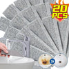 A hand uses a chemical-free pumice stone to remove stains from a white ceramic sink or bowl.