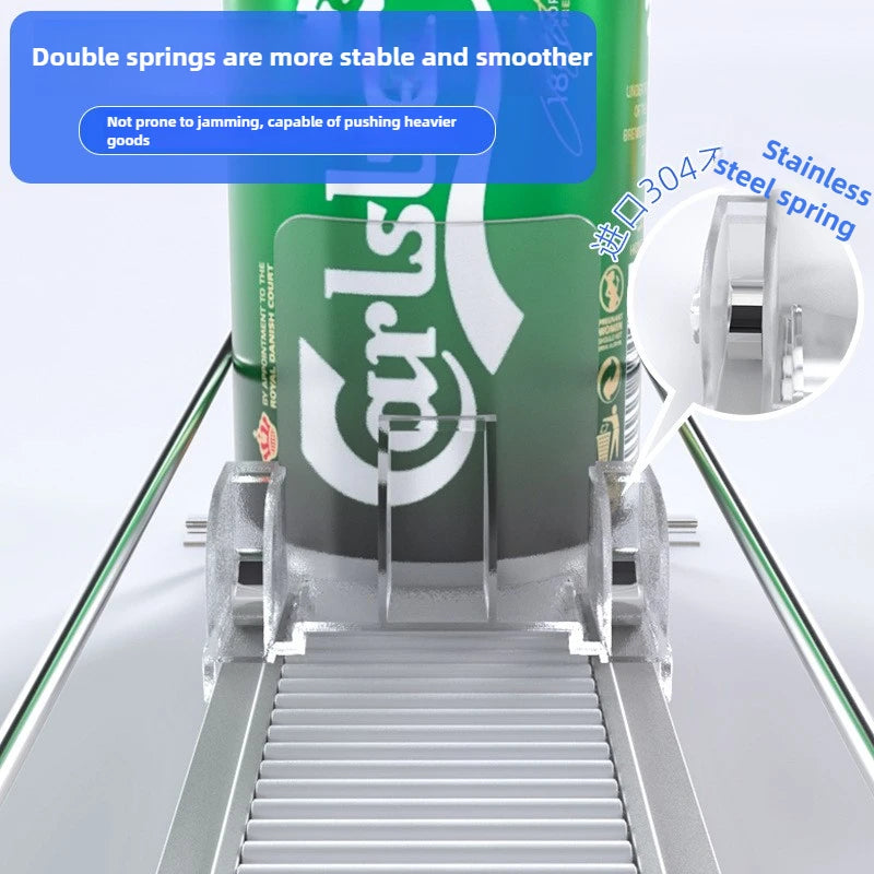 A green can dispenser with double springs is shown inside a metal tray, demonstrating its stability and smoothness.