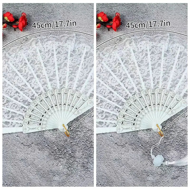 White lace fabric folding hand fan with red accents shown next to a measuring tape.