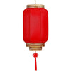 A durable antiqued red Chinese lantern with a gold rim and hanging tassel.
